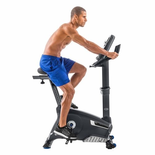 man riding exercise bike